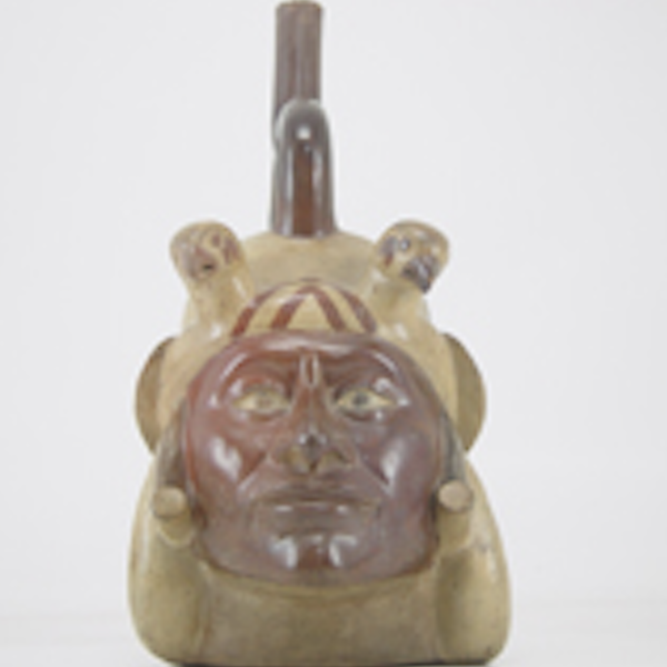 The well-known portrait vessel called Huaco Retrato Mochica, which depicts a man's head wearing a turban with red detailing and a two headed bird on either side. 