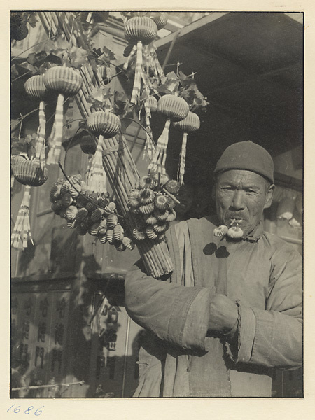 Photo of old man selling toys