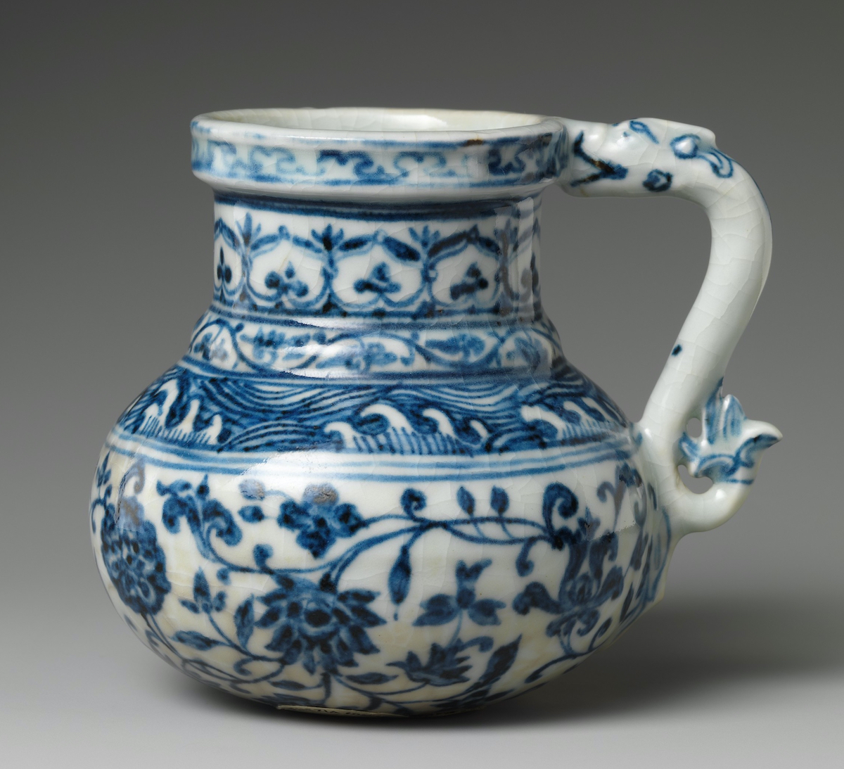 Porcelain tankard with blue ornate decorations 