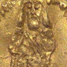 Gold coin engraved with a man holding a scepter