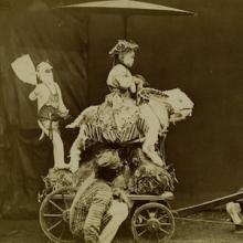 Thumbnail of a photo of a child in costume riding a creature