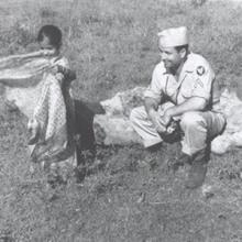 Thumbnail of soldier with child