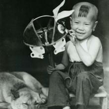 Image of a boy holding a toy