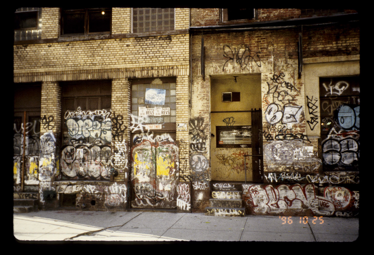 Photo of a wall covered in graffiti